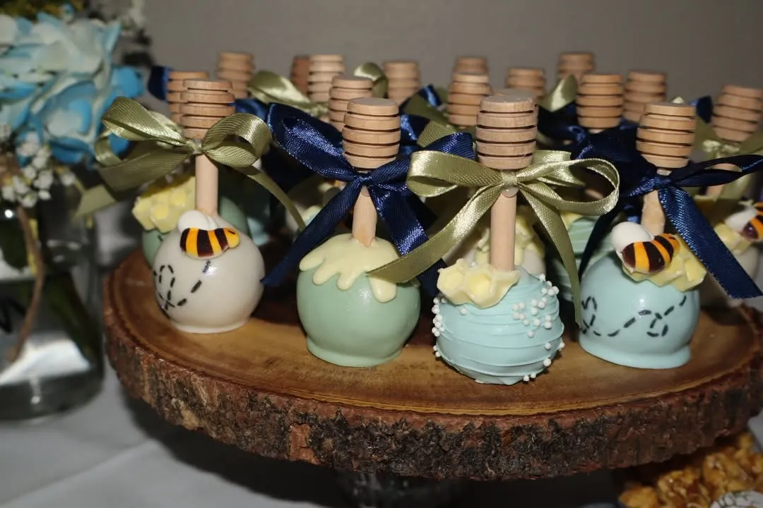 Chocolate dipped treats tied with ribbons for a baby shower