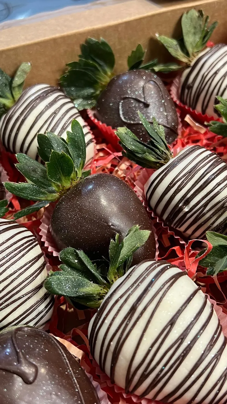 Chocolate covered strawberries with white chocolate stripes