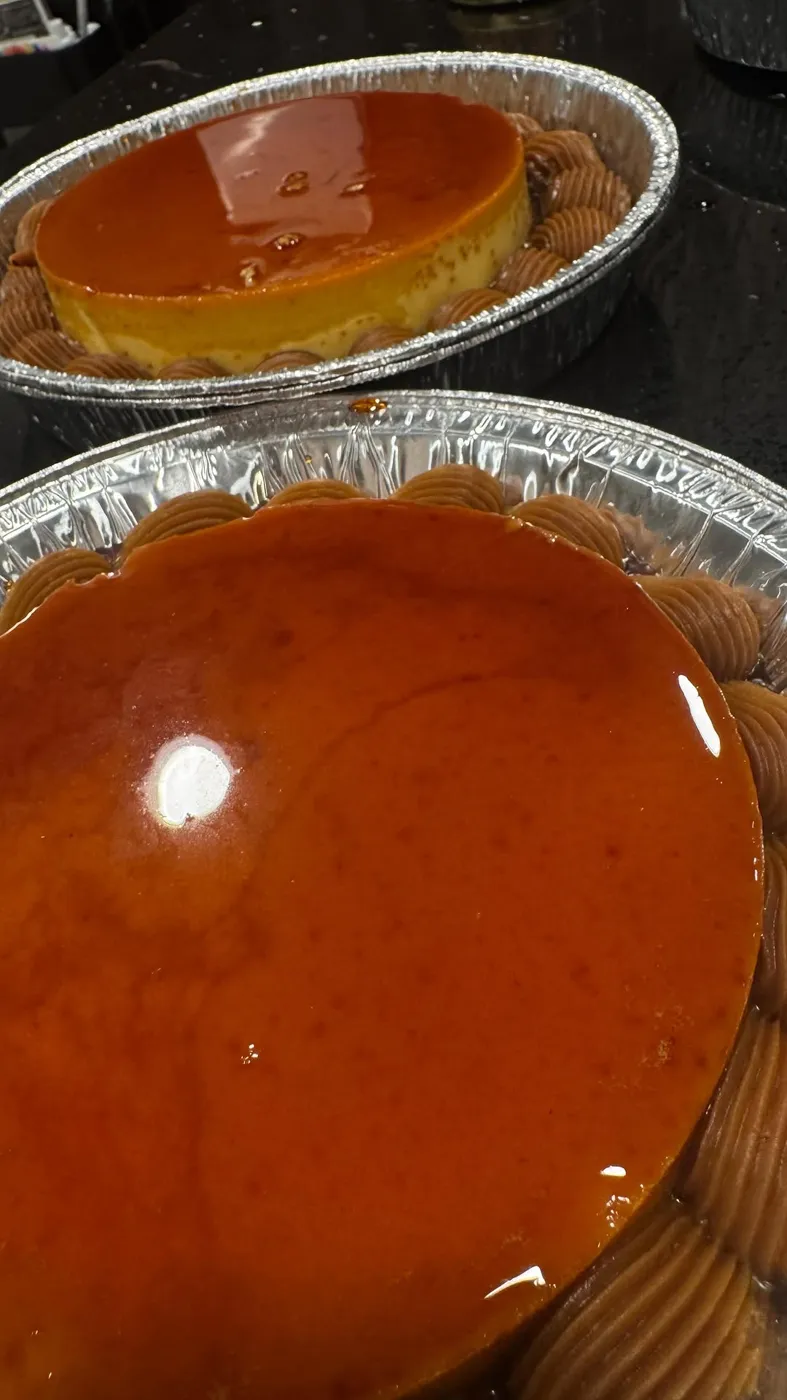 Two homemade flans with glossy caramel