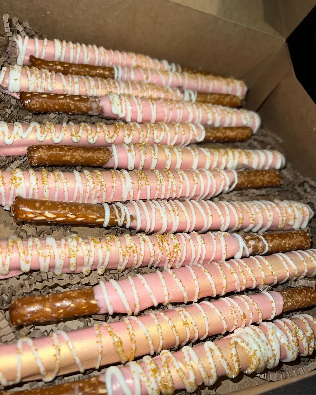 Pink drizzled chocolate pretzel rods